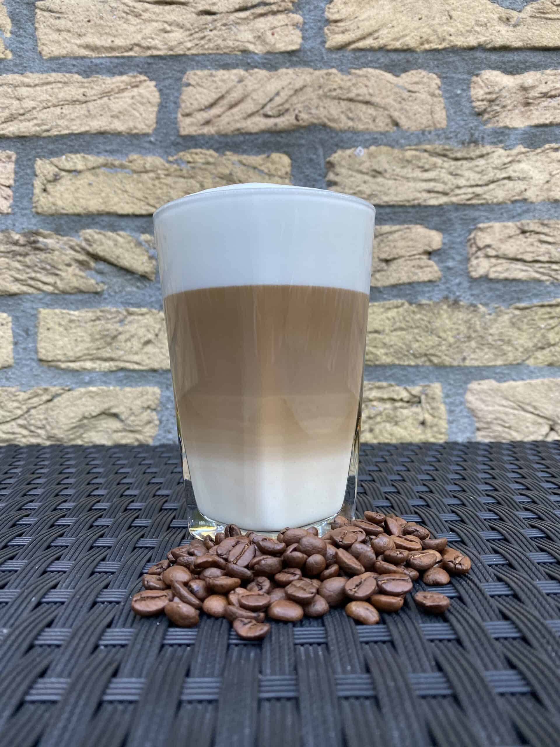 Homemade latte with coffee beans.