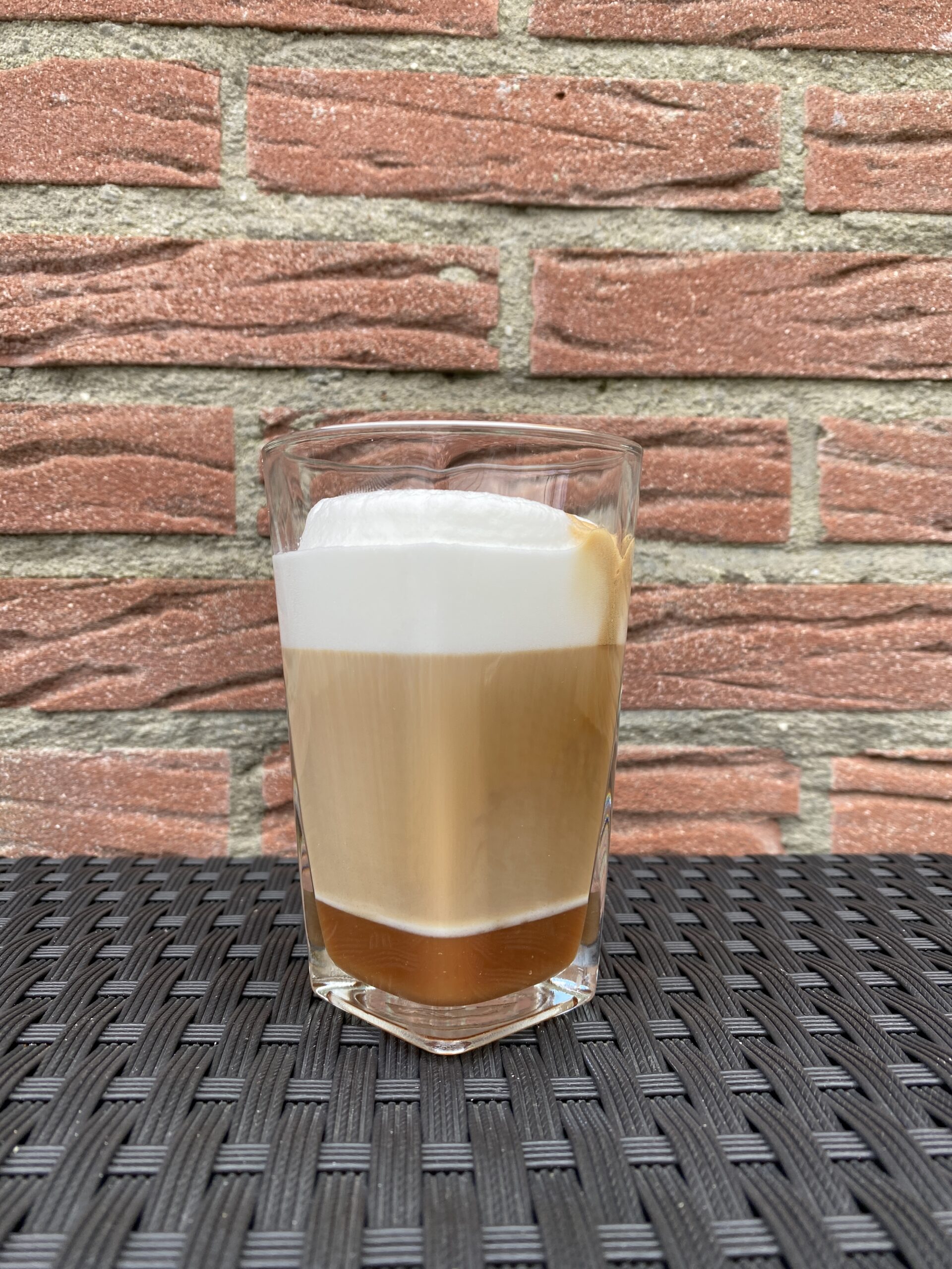 A homemade caramel latte, ready to drink.