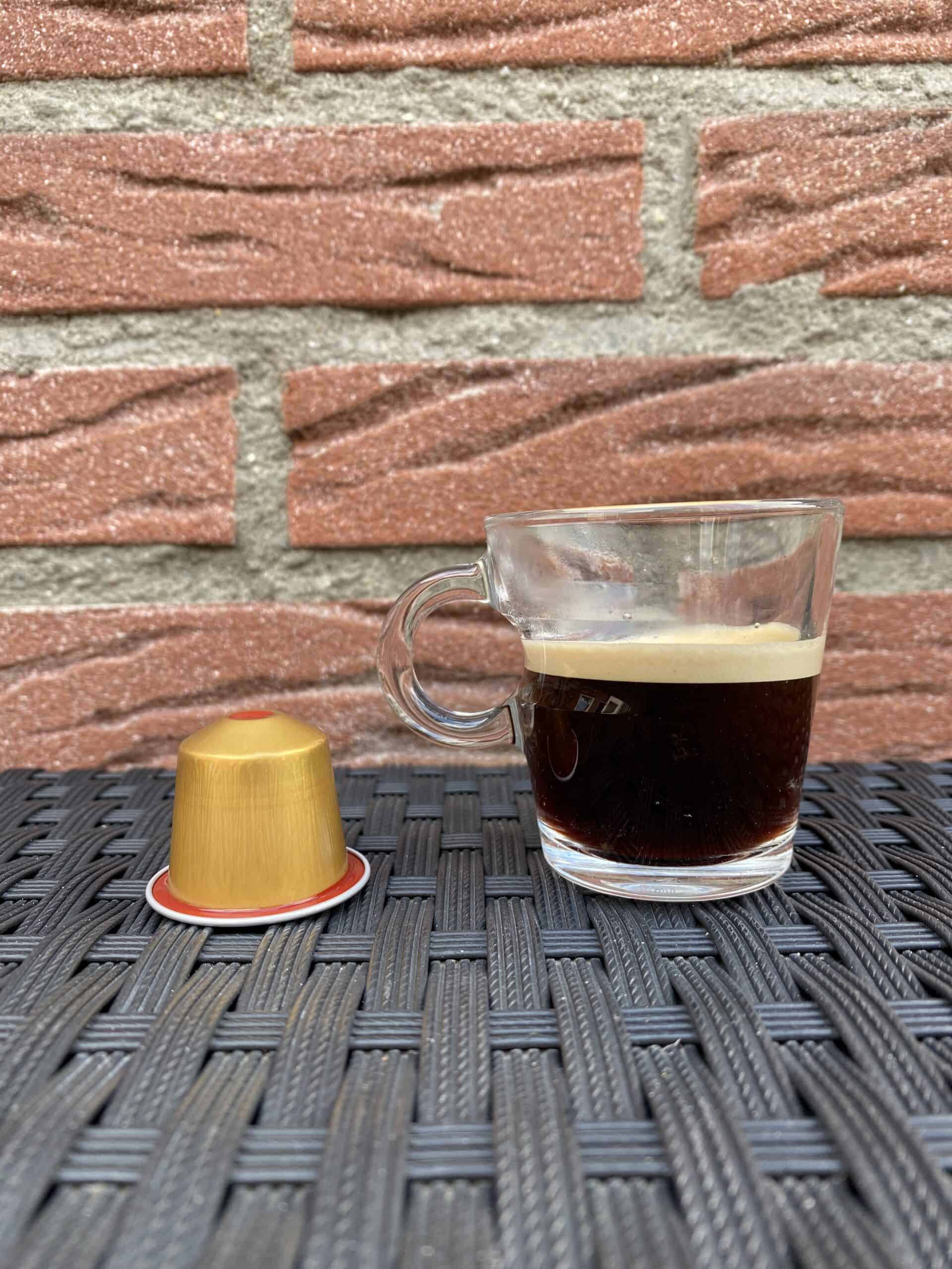 Nespresso Volluto decaf coffee with the pod next to it.