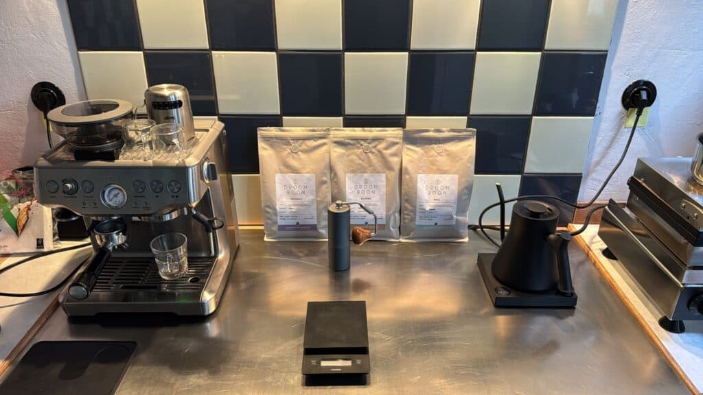 Jeffrey's pop-up coffee bar setup in The Netherlands, featuring a Sage espresso machine and Droom Boon coffee beans.